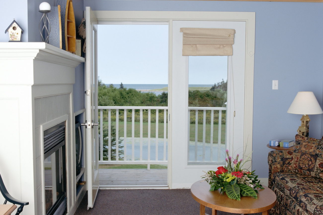 French doors, room with a view and a deck at Rodd Crowbush cottage