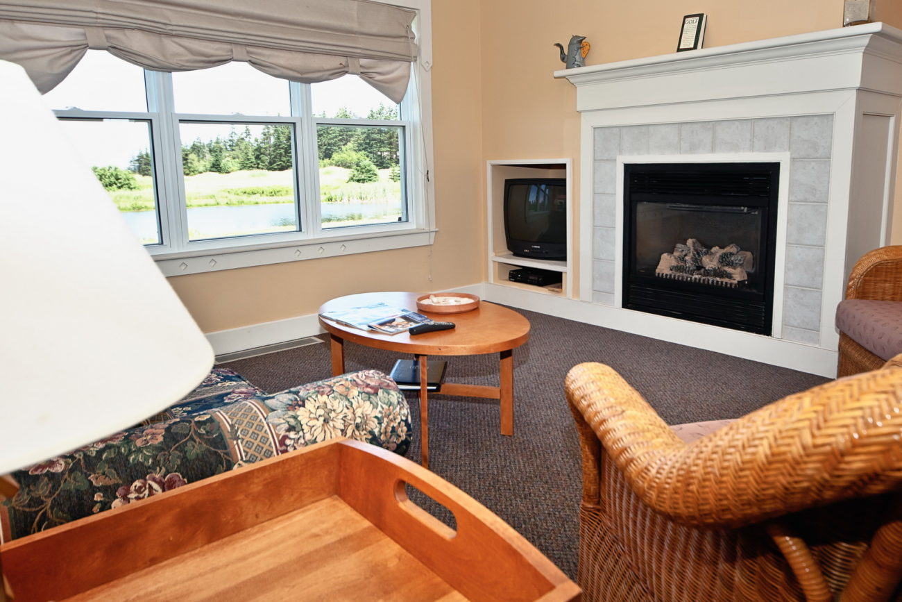 Fireplace and a living room in the Rodd Crowbush resort cottages.